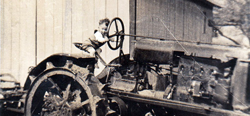 A young Harold Thorpe on a tractor