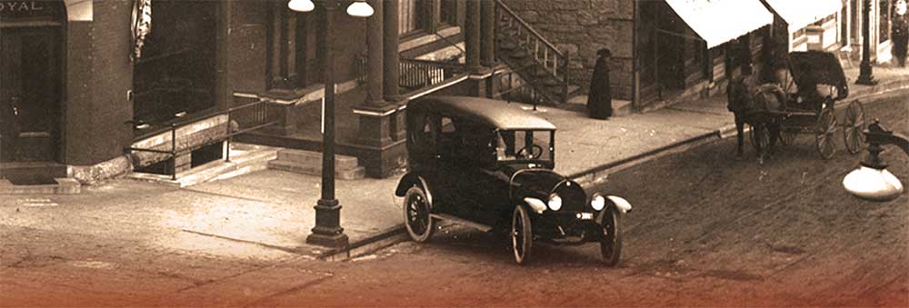 Model T car in sepia photograph