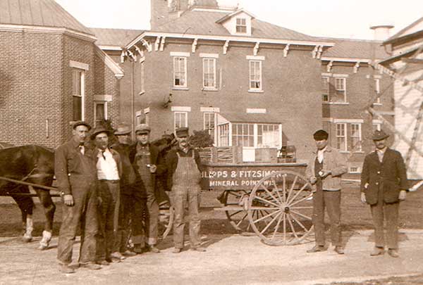 Will Fitzsimons, second from right, and his lightning-rod wagon